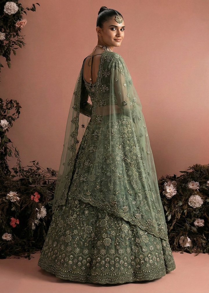 Buy Now Awesome Green Heavy Net Embroidered Bridal Lehenga Choli Online in USA, UK, France, Canada, Italy, Sweden, Greece, UAE & Worldwide at Empress Clothing.