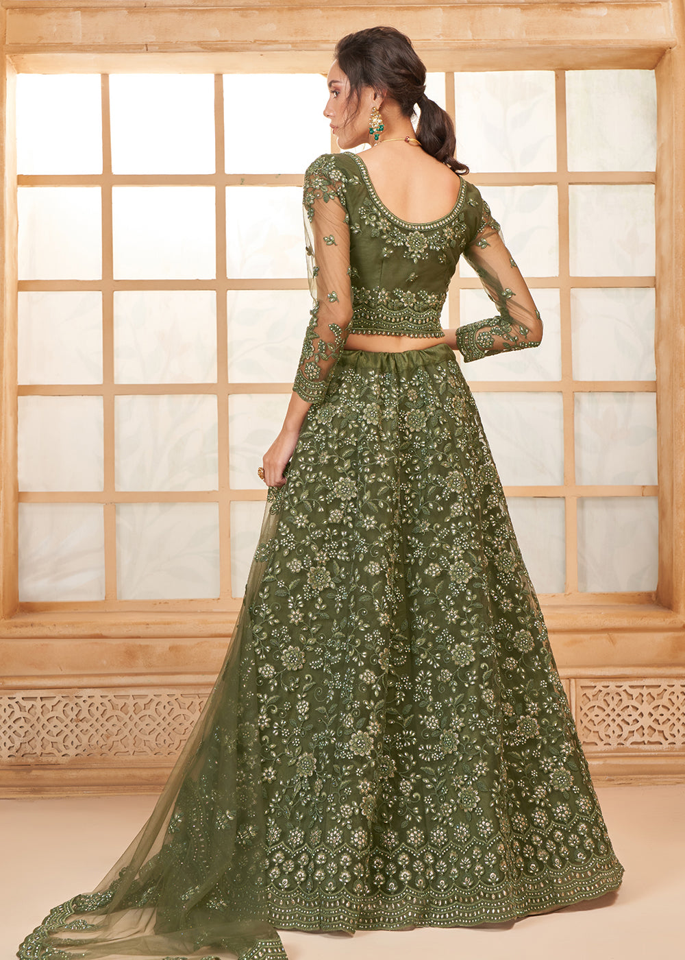 Buy Now Attractive Green Heavy Net Embroidered Bridal Lehenga Choli Online in USA, UK, France, UAE & Worldwide at Empress Clothing.