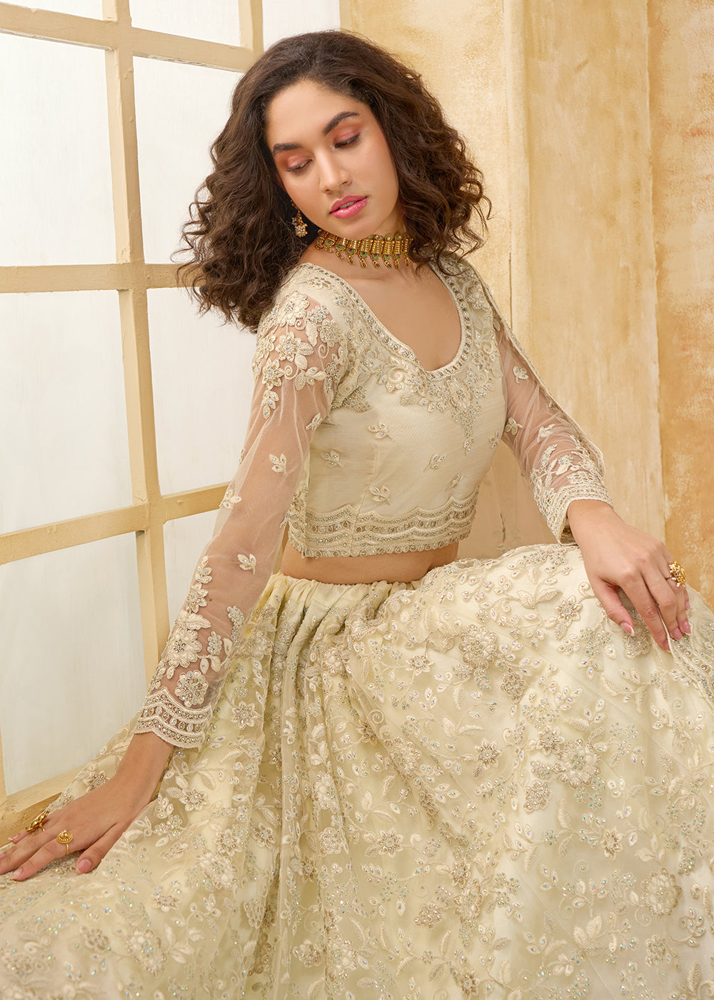 Buy Now Attractive Cream Heavy Net Embroidered Bridal Lehenga Choli Online in USA, UK, France, UAE & Worldwide at Empress Clothing. 