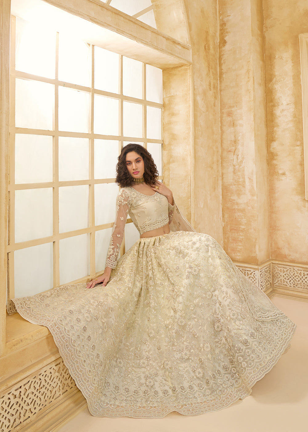 Buy Now Attractive Cream Heavy Net Embroidered Bridal Lehenga Choli Online in USA, UK, France, UAE & Worldwide at Empress Clothing. 