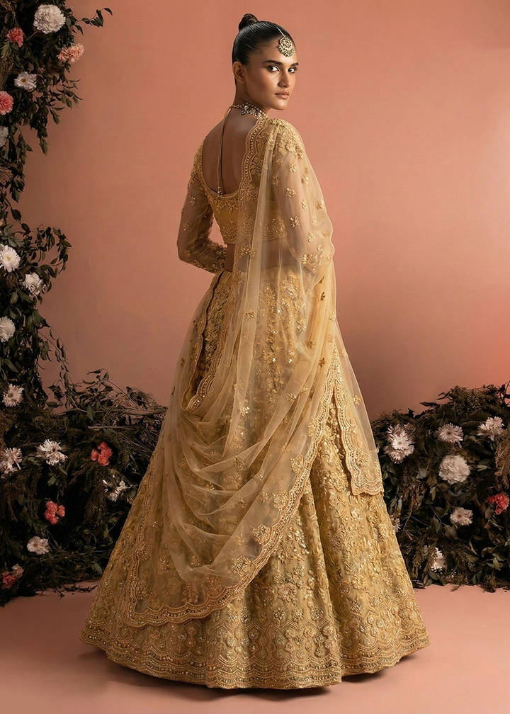 Buy Now Awesome Golden Heavy Net Embroidered Bridal Lehenga Choli Online in USA, UK, France, Canada, Italy, Sweden, Greece, UAE & Worldwide at Empress Clothing.