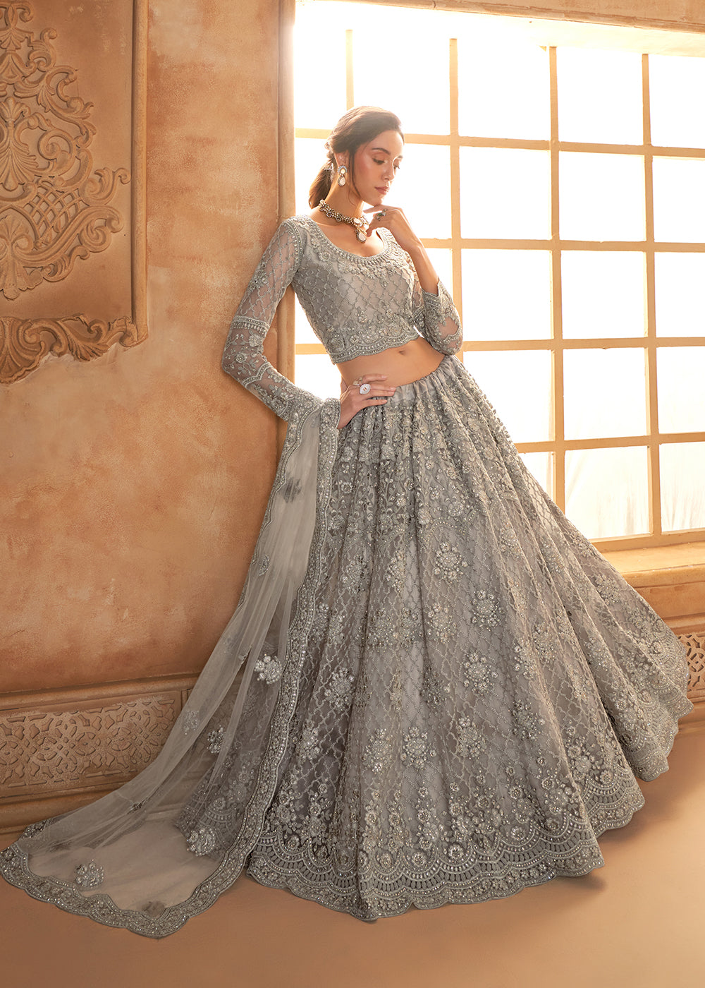 Buy Now Lovely Grey Heavy Net Embroidered Bridal Lehenga Choli Online in USA, UK, France, UAE & Worldwide at Empress Clothing.