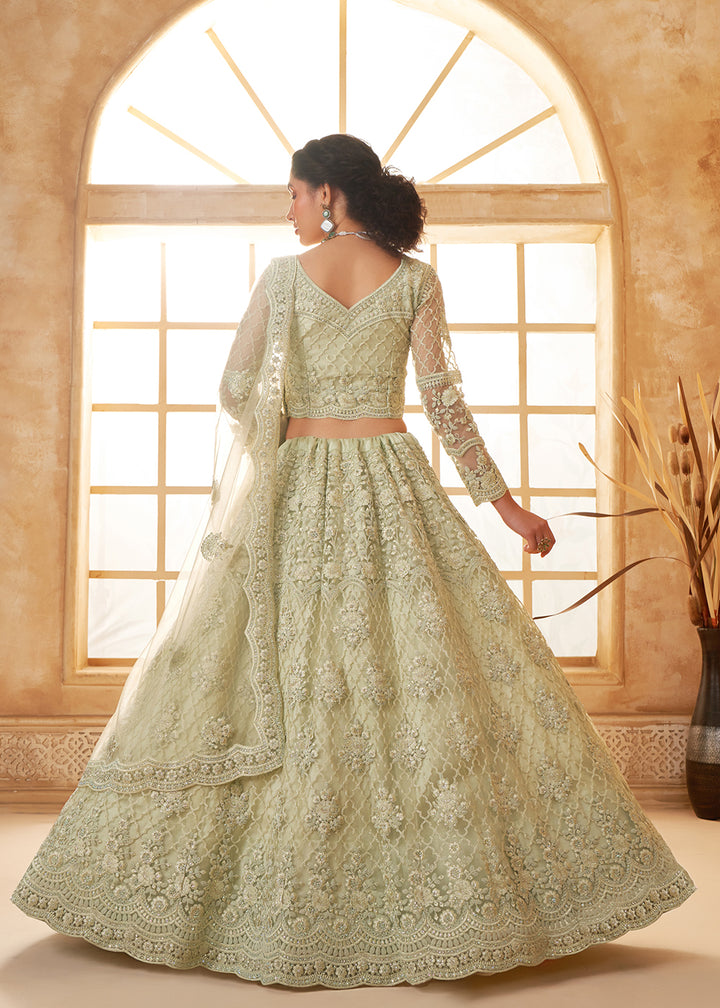 Buy Now Lovely Green Heavy Net Embroidered Bridal Lehenga Choli Online in USA, UK, France, UAE & Worldwide at Empress Clothing. 