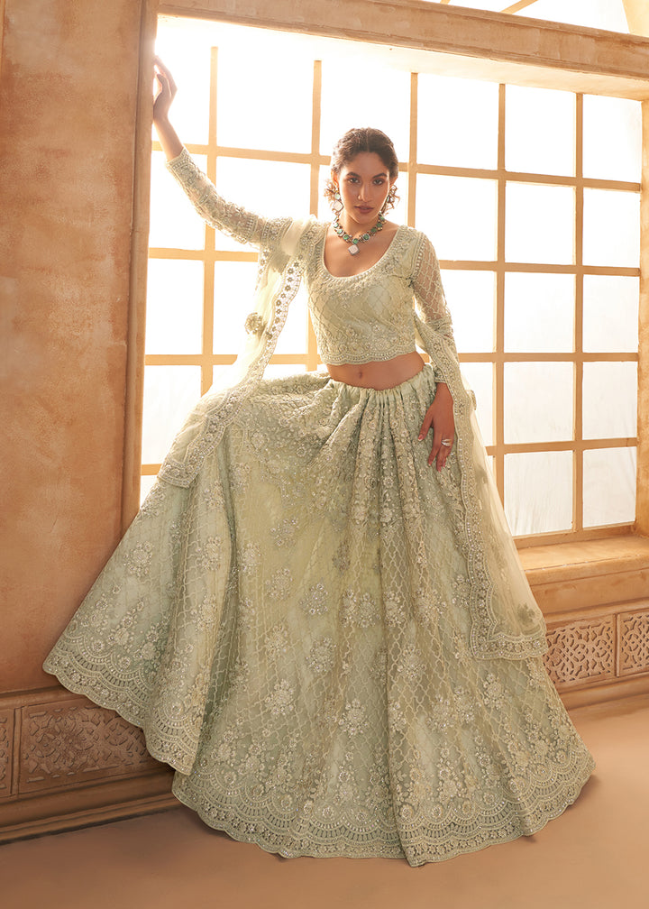 Buy Now Lovely Green Heavy Net Embroidered Bridal Lehenga Choli Online in USA, UK, France, UAE & Worldwide at Empress Clothing. 