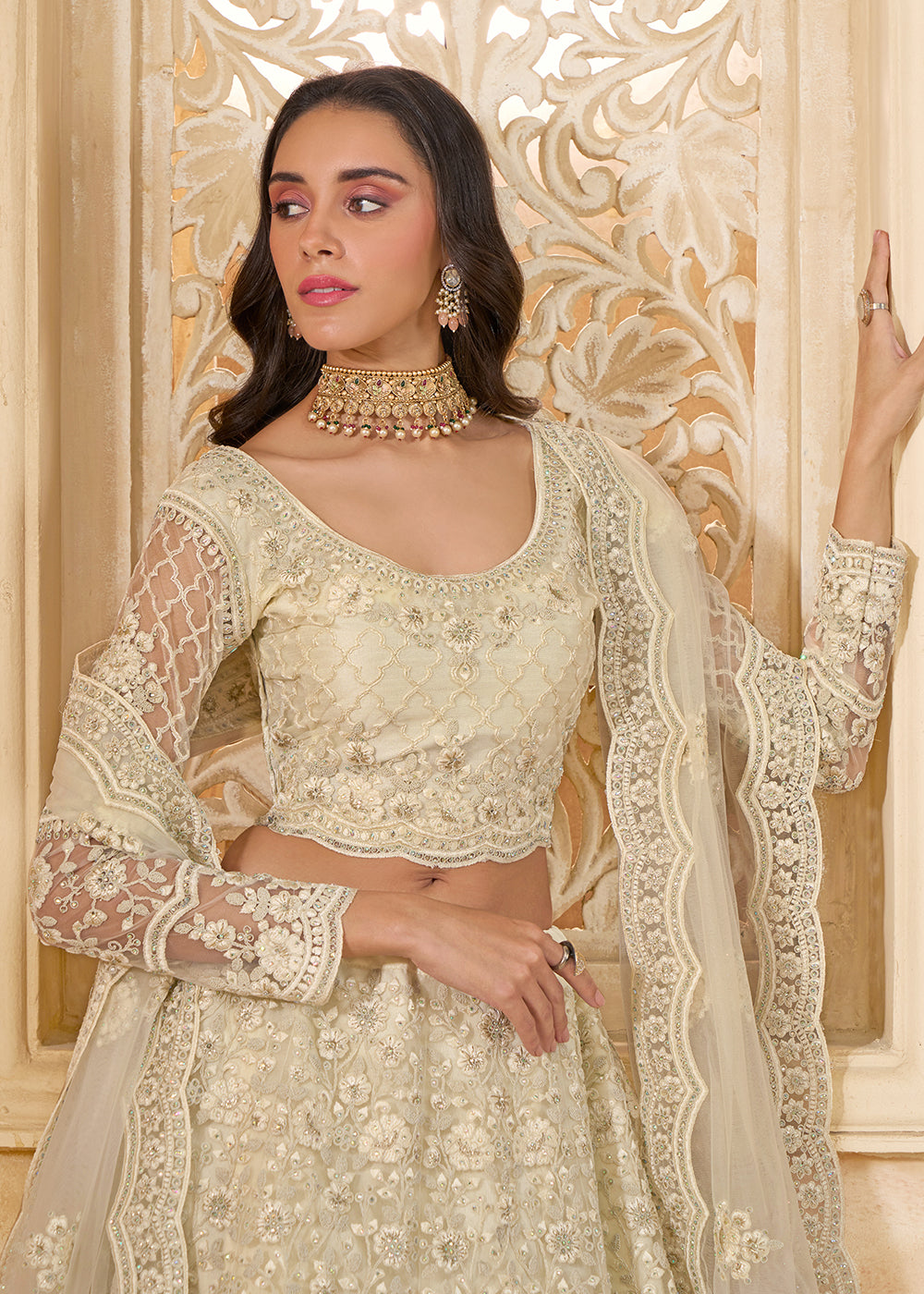 Buy Now Lovely Cream Heavy Net Embroidered Bridal Lehenga Choli Online in USA, UK, France, UAE & Worldwide at Empress Clothing. 