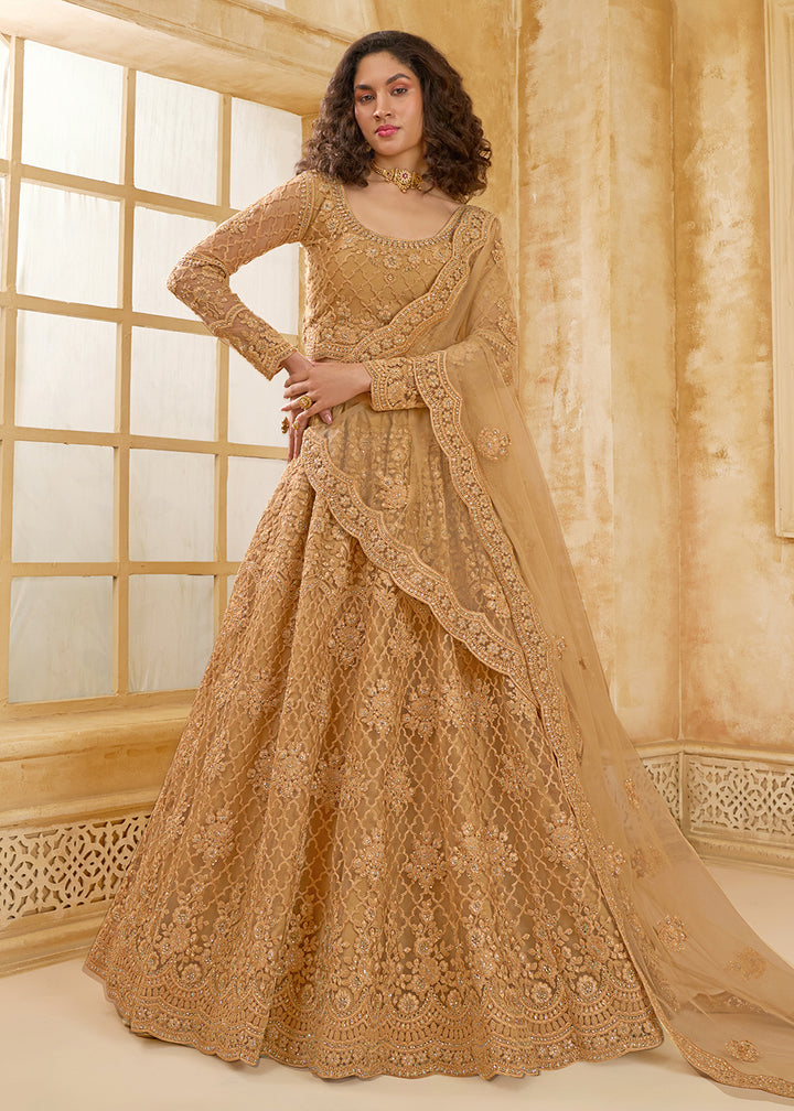 Buy Now Lovely Golden Heavy Net Embroidered Bridal Lehenga Choli Online in USA, UK, France, UAE & Worldwide at Empress Clothing. 