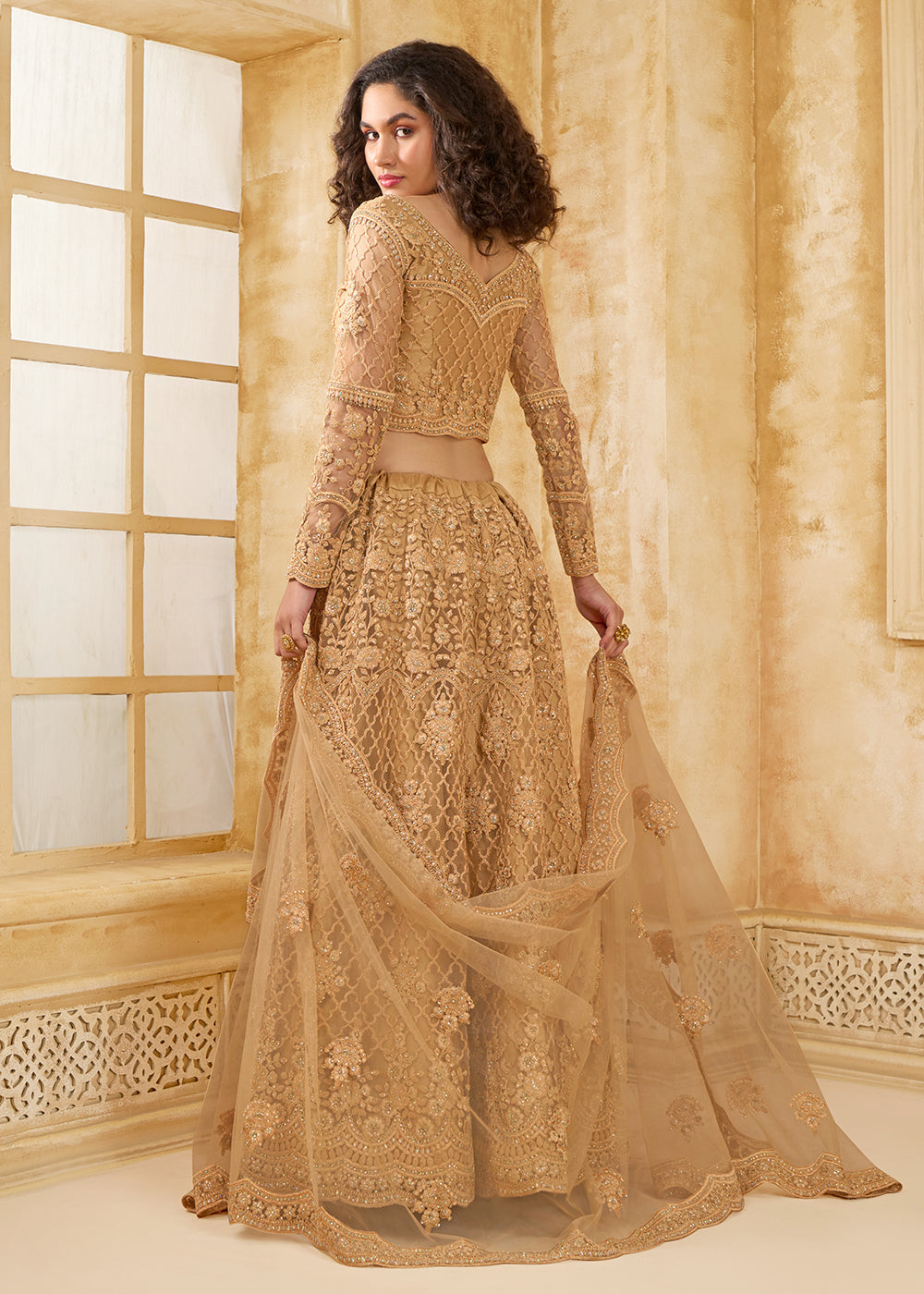 Buy Now Lovely Golden Heavy Net Embroidered Bridal Lehenga Choli Online in USA, UK, France, UAE & Worldwide at Empress Clothing. 