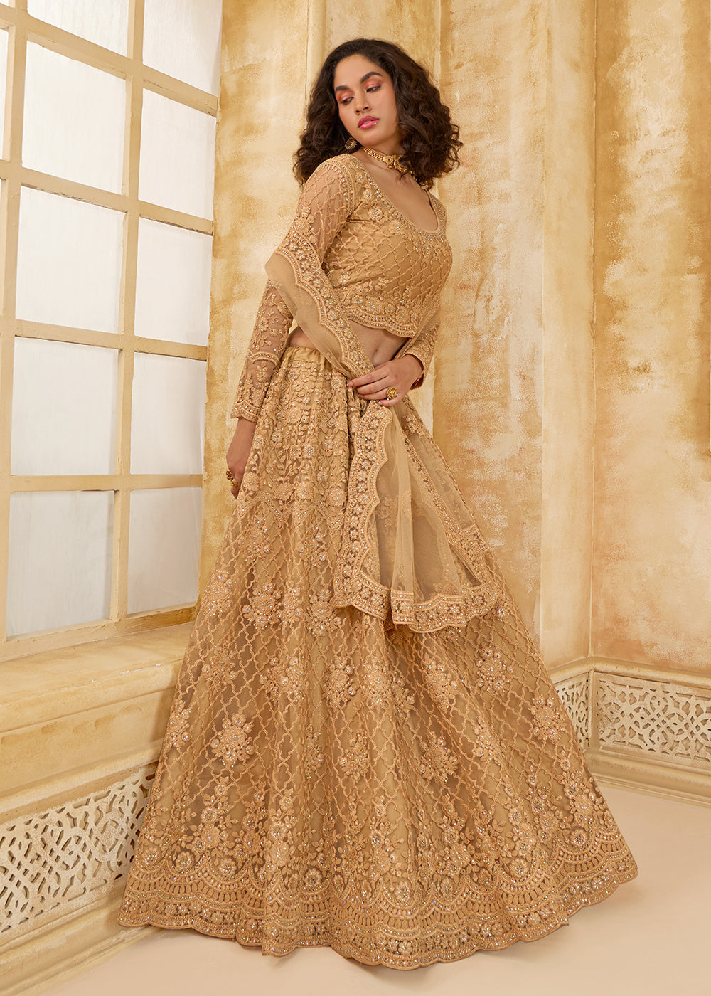 Buy Now Lovely Golden Heavy Net Embroidered Bridal Lehenga Choli Online in USA, UK, France, UAE & Worldwide at Empress Clothing. 