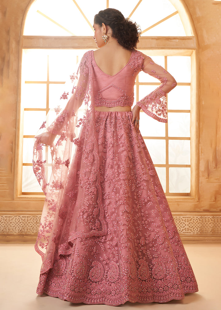 Buy Now Awesome Pink Heavy Net Embroidered Bridal Lehenga Choli Online in USA, UK, France, UAE & Worldwide at Empress Clothing. 