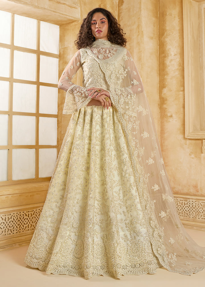 Buy Now Awesome Cream Heavy Net Embroidered Bridal Lehenga Choli Online in USA, UK, France, UAE & Worldwide at Empress Clothing. 