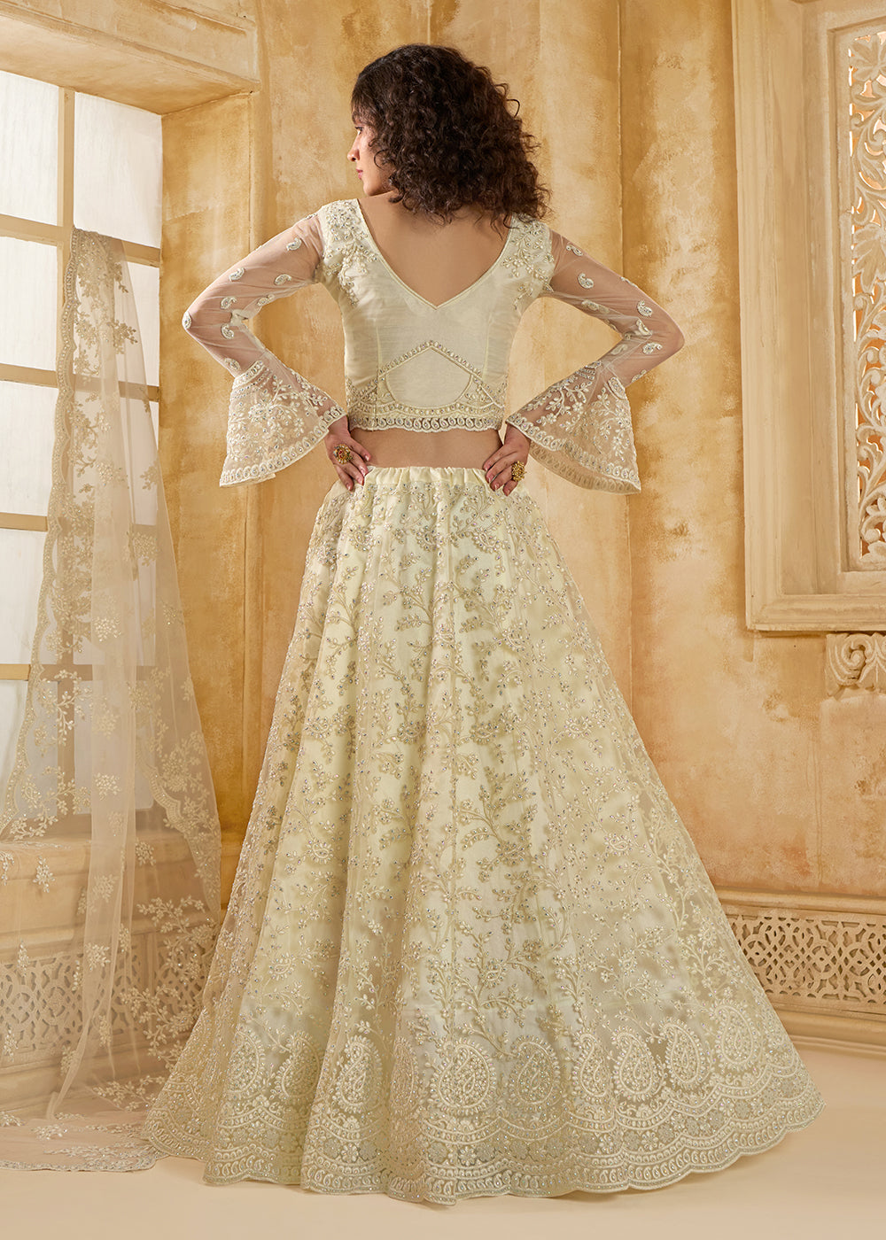 Buy Now Awesome Cream Heavy Net Embroidered Bridal Lehenga Choli Online in USA, UK, France, UAE & Worldwide at Empress Clothing. 