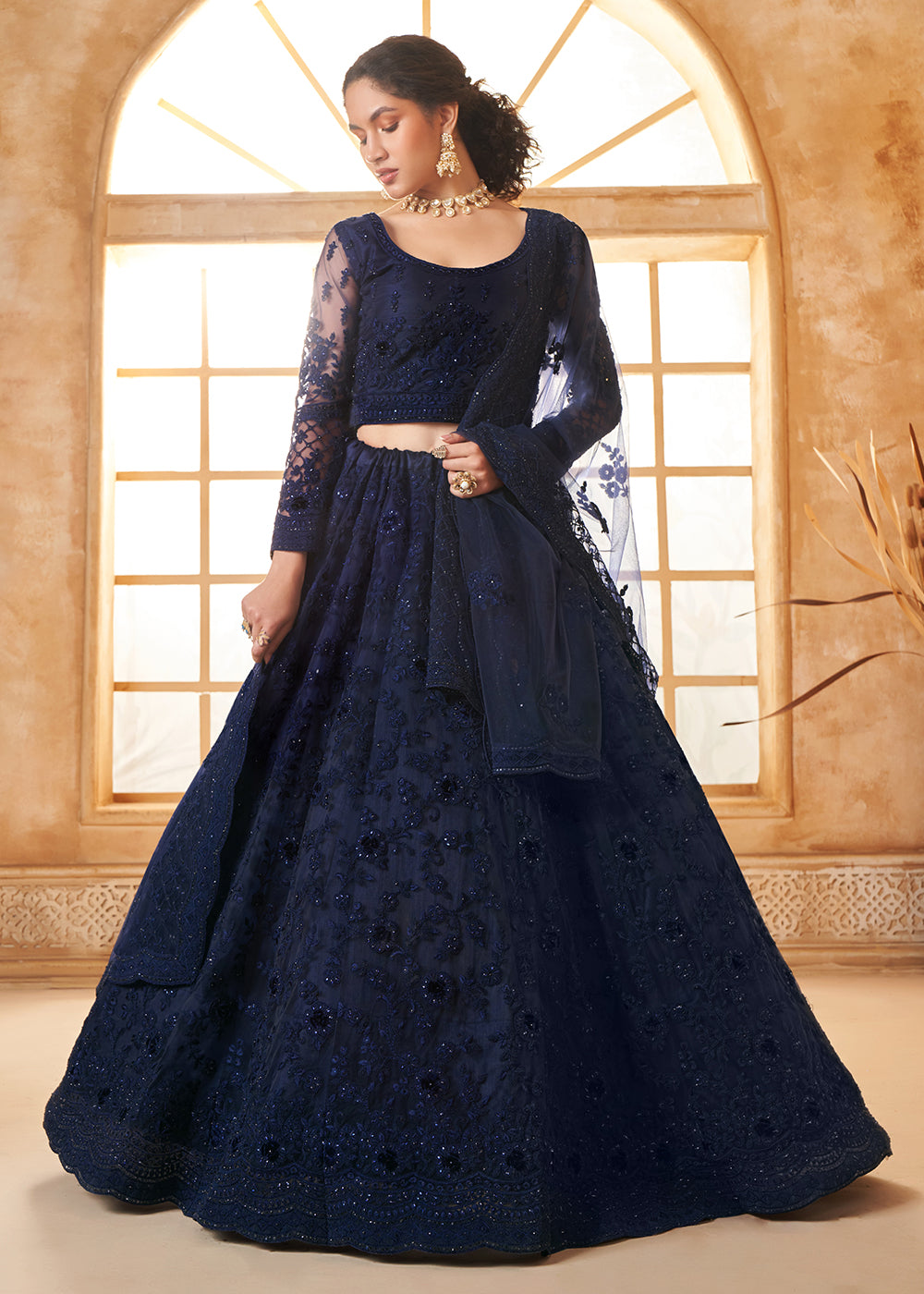 Buy Now Stunning Blue Heavy Net Embroidered Bridal Lehenga Choli Online in USA, UK, France, UAE & Worldwide at Empress Clothing. 