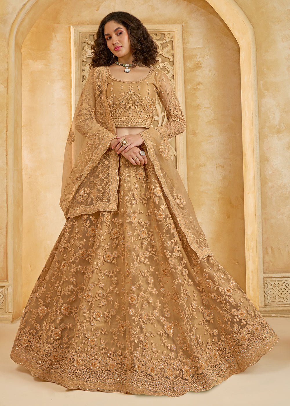 Buy Now Stunning Golden Heavy Net Embroidered Bridal Lehenga Choli Online in USA, UK, France, UAE & Worldwide at Empress Clothing.