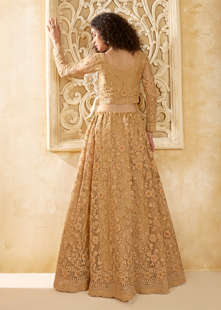 Buy Now Stunning Golden Heavy Net Embroidered Bridal Lehenga Choli Online in USA, UK, France, UAE & Worldwide at Empress Clothing.