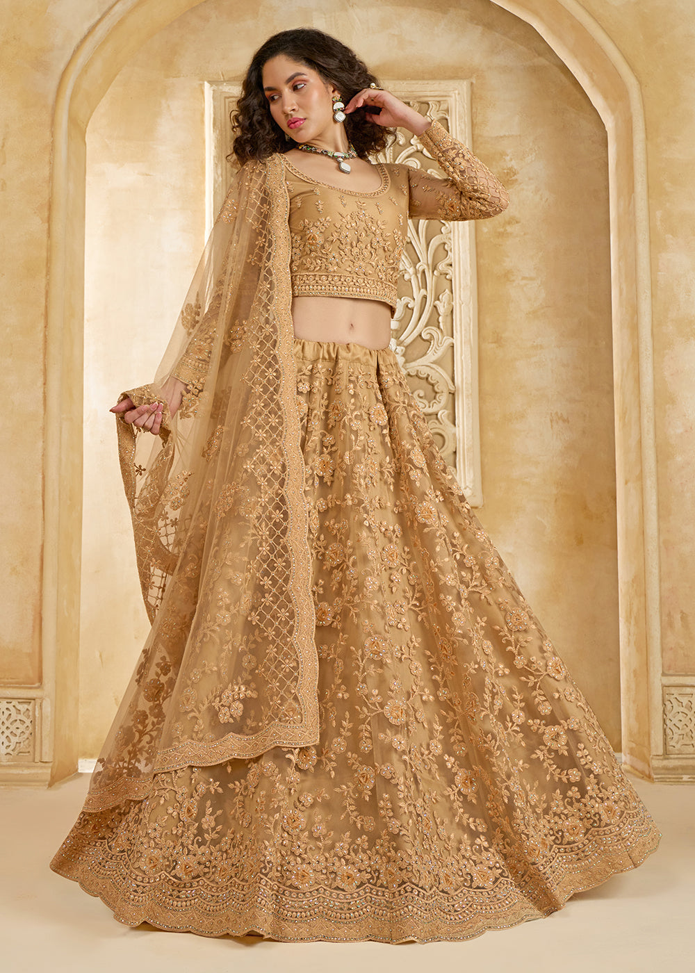 Buy Now Stunning Golden Heavy Net Embroidered Bridal Lehenga Choli Online in USA, UK, France, UAE & Worldwide at Empress Clothing.