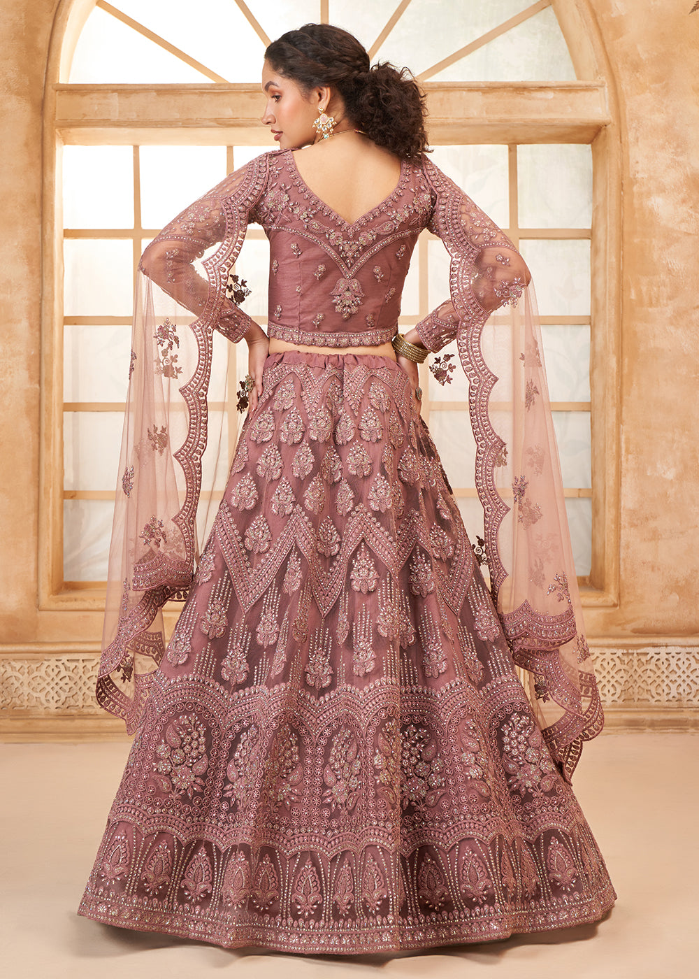 Buy Now Gorgeous Mauve Heavy Net Embroidered Bridal Lehenga Choli Online in USA, UK, France, UAE & Worldwide at Empress Clothing. 