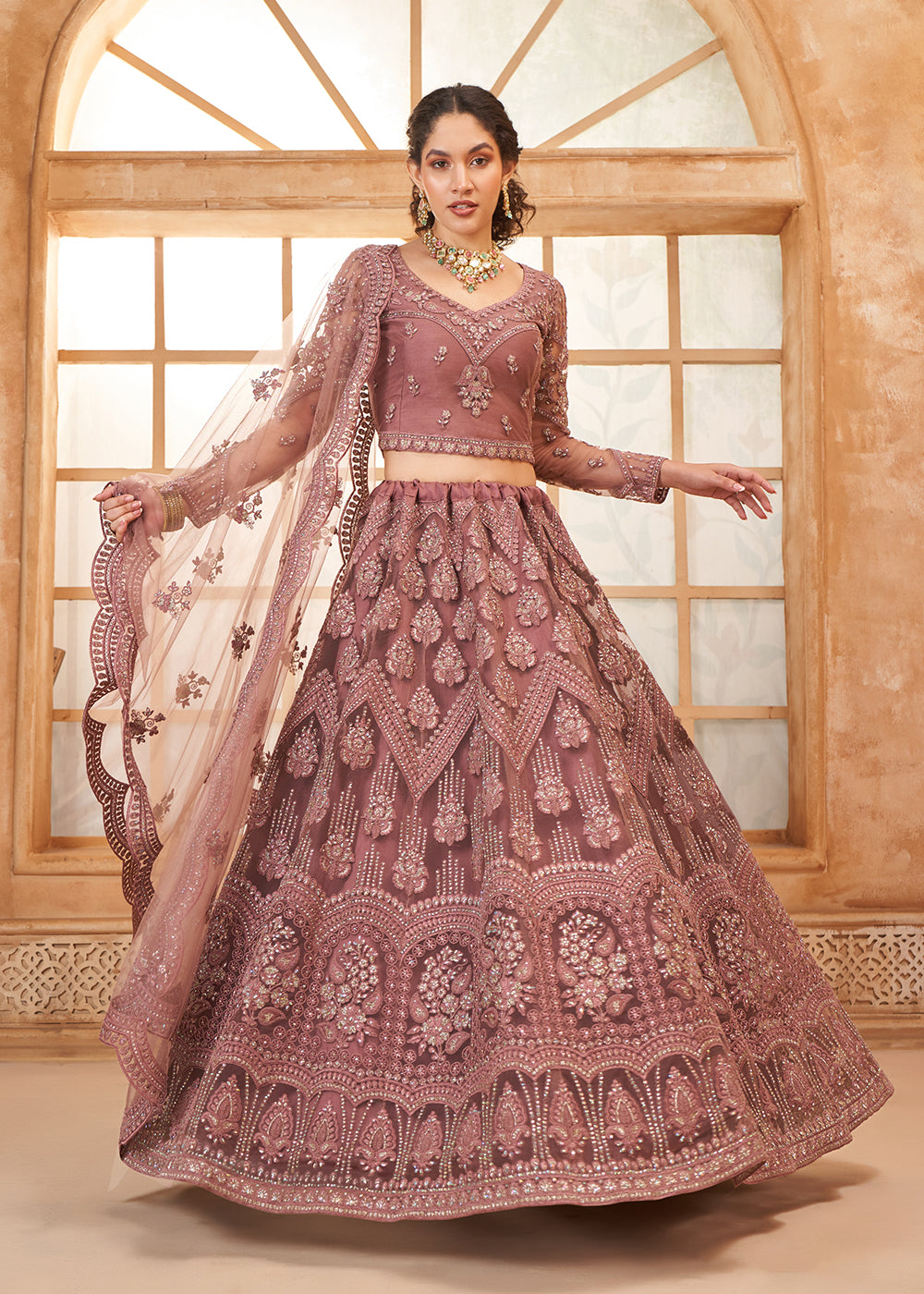 Buy Now Gorgeous Mauve Heavy Net Embroidered Bridal Lehenga Choli Online in USA, UK, France, UAE & Worldwide at Empress Clothing. 