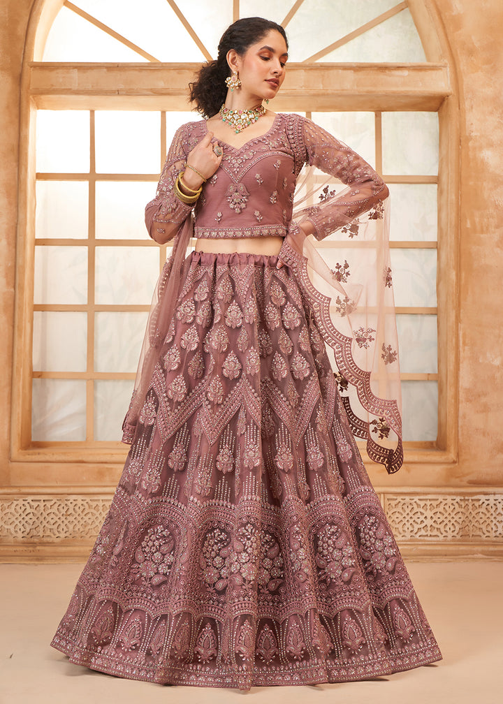 Buy Now Gorgeous Mauve Heavy Net Embroidered Bridal Lehenga Choli Online in USA, UK, France, UAE & Worldwide at Empress Clothing. 