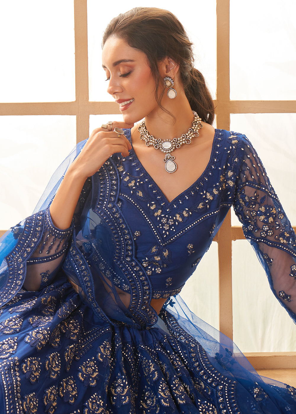 Buy Now Gorgeous Blue Heavy Net Embroidered Bridal Lehenga Choli Online in USA, UK, France, UAE & Worldwide at Empress Clothing.