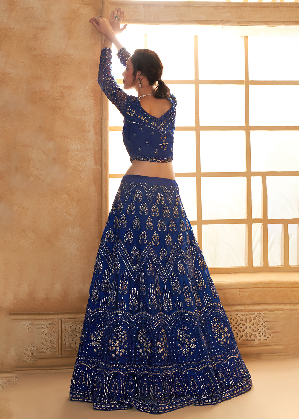 Buy Now Gorgeous Blue Heavy Net Embroidered Bridal Lehenga Choli Online in USA, UK, France, UAE & Worldwide at Empress Clothing.