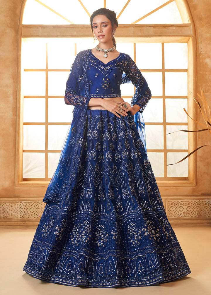 Buy Now Gorgeous Blue Heavy Net Embroidered Bridal Lehenga Choli Online in USA, UK, France, UAE & Worldwide at Empress Clothing.