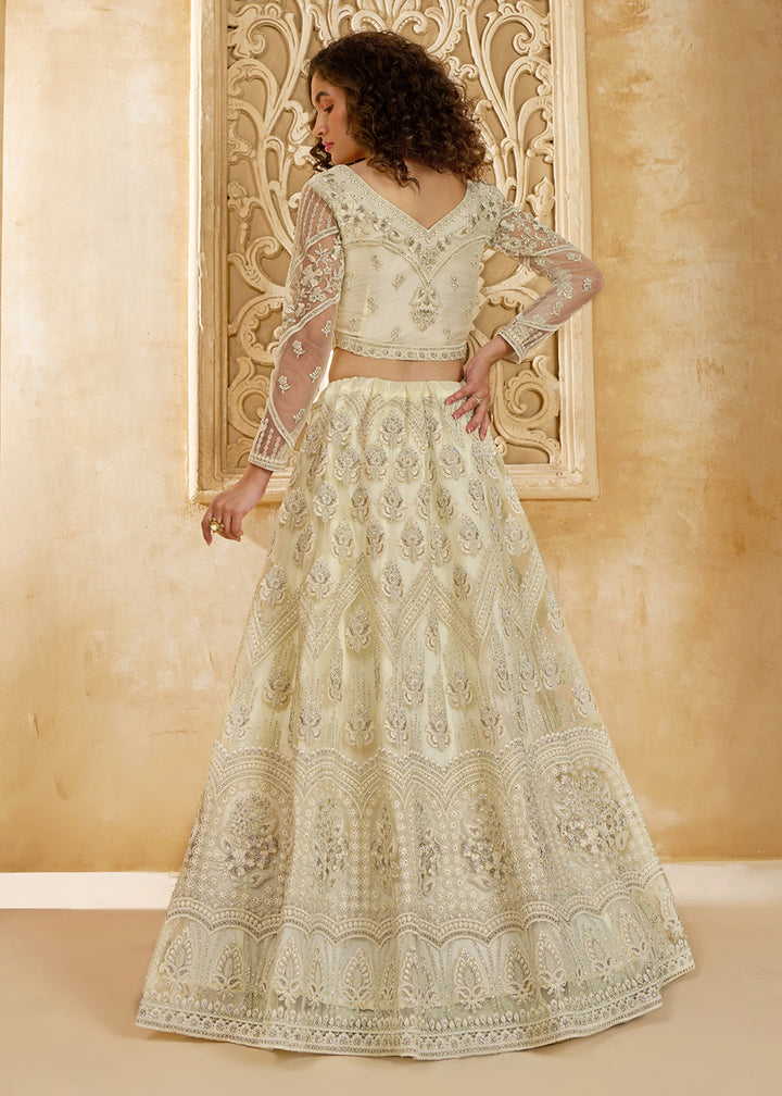 Buy Now Gorgeous Cream Heavy Net Embroidered Bridal Lehenga Choli Online in USA, UK, France, UAE & Worldwide at Empress Clothing.