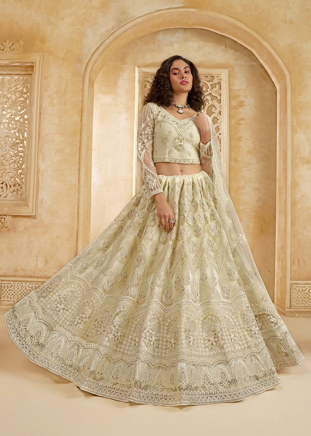 Buy Now Gorgeous Cream Heavy Net Embroidered Bridal Lehenga Choli Online in USA, UK, France, UAE & Worldwide at Empress Clothing.