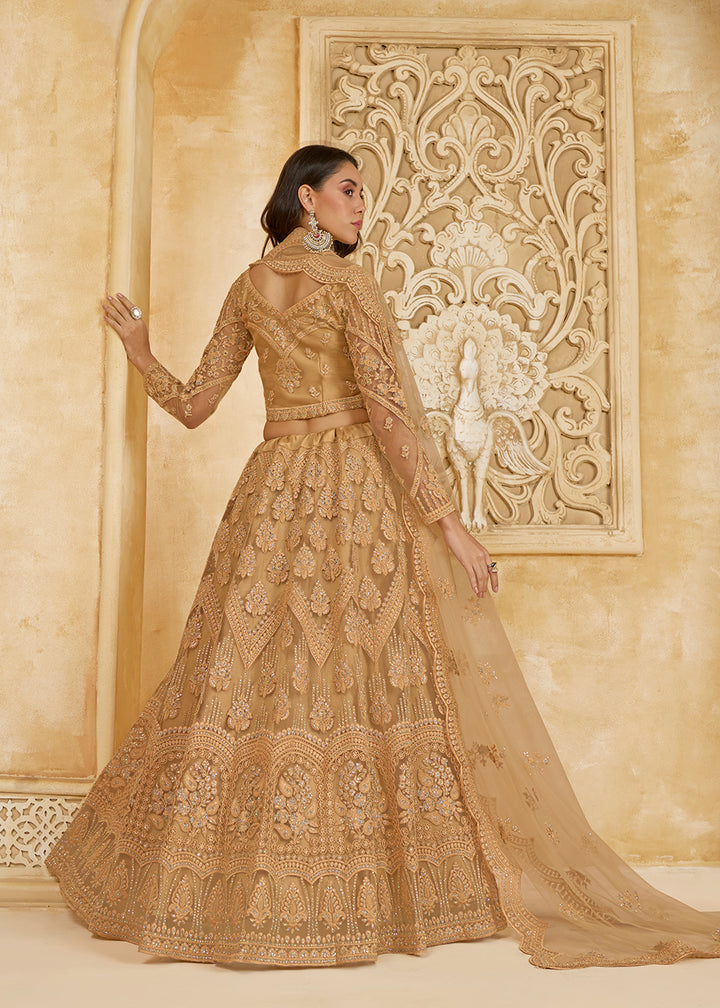 Buy Now Gorgeous Golden Heavy Net Embroidered Bridal Lehenga Choli Online in USA, UK, France, UAE & Worldwide at Empress Clothing. 