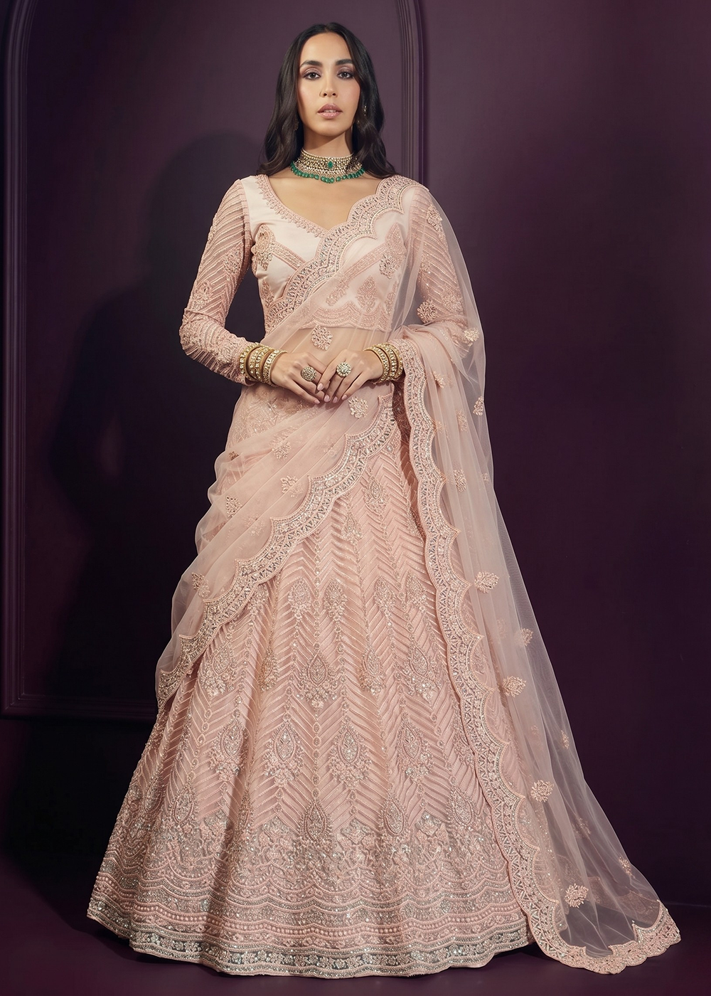 Buy Now Pinkish Peach Net Embroidered Bridesmaids Lehenga Choli Online in US, UK, Canada, France, Italy, Greece, Sweden, Netherlands, UAE &amp; Worldwide at Empress.
