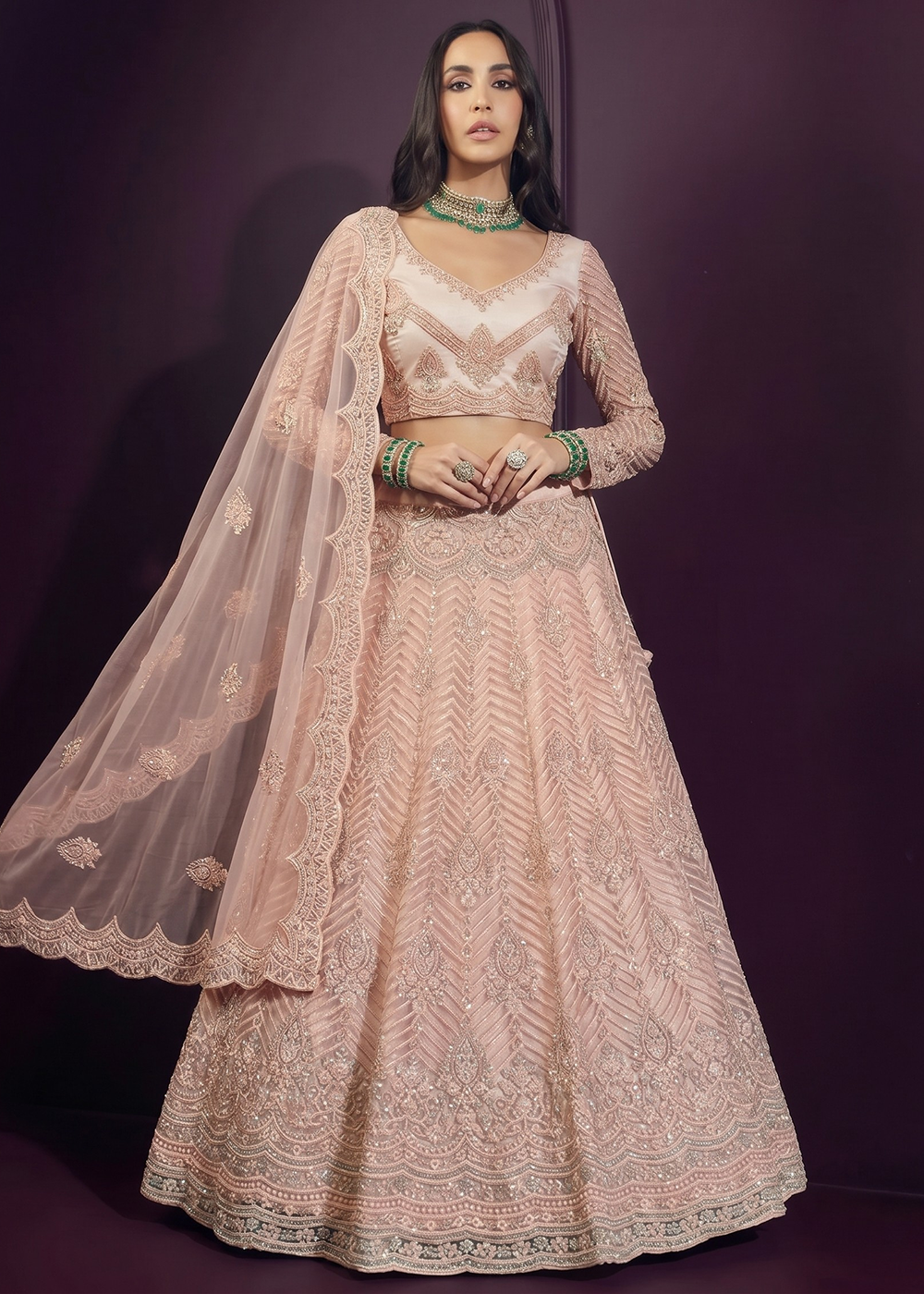 Buy Now Pinkish Peach Net Embroidered Bridesmaids Lehenga Choli Online in US, UK, Canada, France, Italy, Greece, Sweden, Netherlands, UAE & Worldwide at Empress.