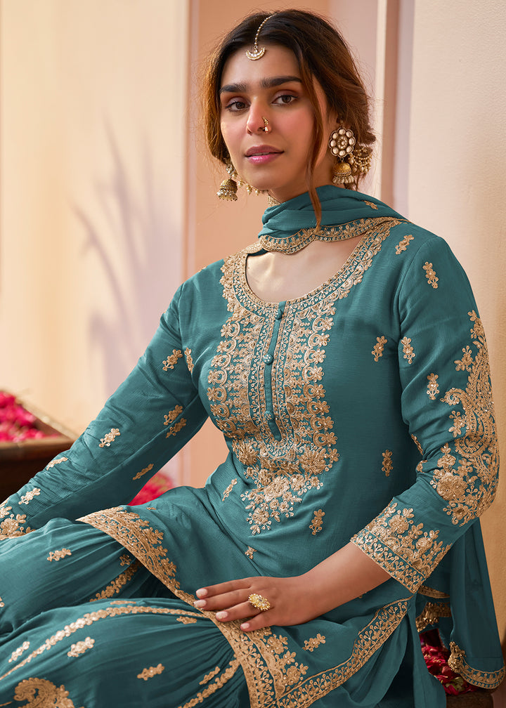 Shop Now Real Chinnon Teal Blue Embroidered Festive Gharara Suit Online at Empress in US, UK, Canada, Germany, Australia, Sweden, Denmark, Africa & Worldwide.