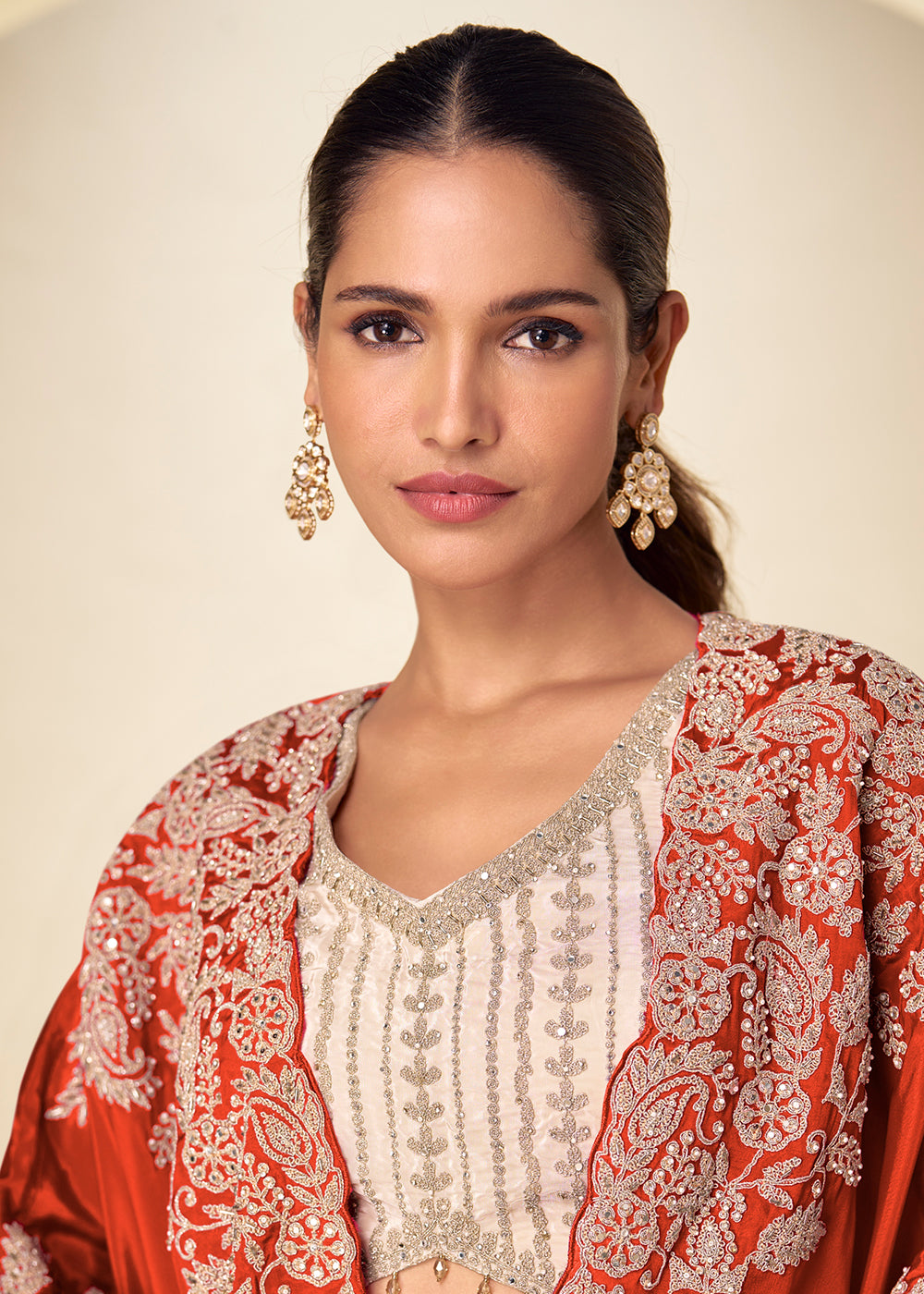 Buy Now Ivory Cream Dhoti Style Indo Western Dress with Orange Shrug Online in US, UK, Canada, Netherlands, Germany, Italy, France, Greece & Worldwide at Empress.