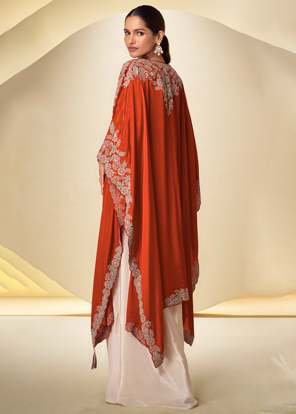 Buy Now Ivory Cream Dhoti Style Indo Western Dress with Orange Shrug Online in US, UK, Canada, Netherlands, Germany, Italy, France, Greece &amp; Worldwide at Empress.
