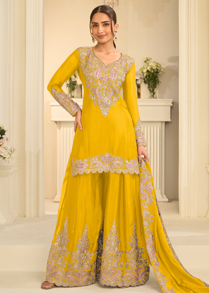 Shop Now Yellow Real Chinnon Festive Gharara Style Suit Online at Empress in US, UK, Canada, Italy, Germany, France, Greece, Sweden, UAE, Austria &amp; Worldwide.