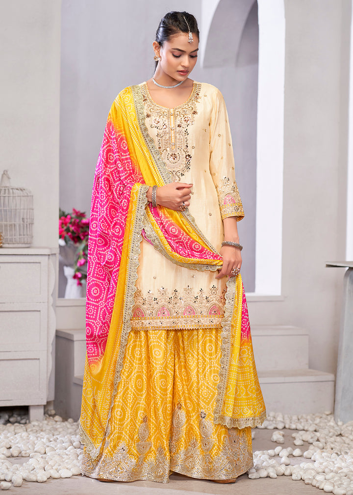 Buy Now Cream & Yellow Dabka Dori Work Ethnic Sharara Suit Online in USA, UK, Canada, Germany, Italy, France, Austria, Denmark, UAE & Worldwide at Empress.