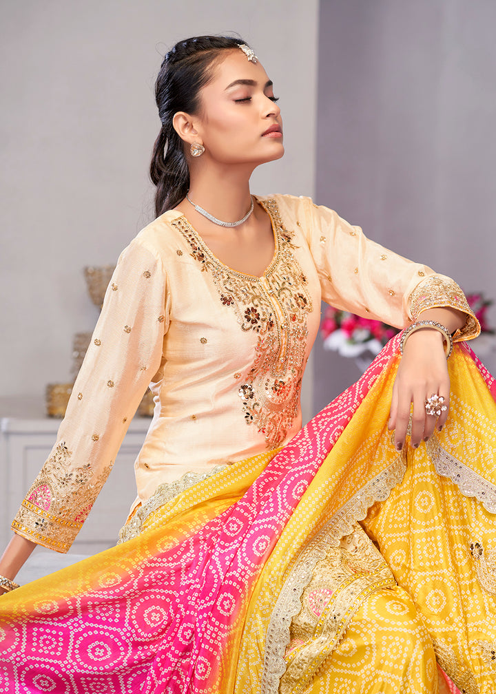 Buy Now Cream & Yellow Dabka Dori Work Ethnic Sharara Suit Online in USA, UK, Canada, Germany, Italy, France, Austria, Denmark, UAE & Worldwide at Empress.