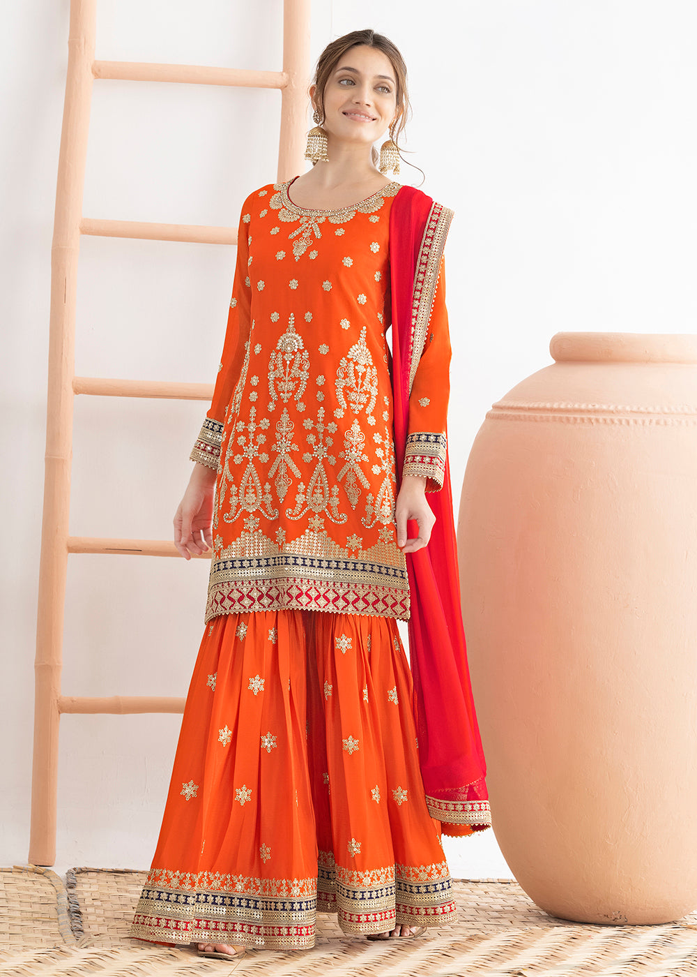 Buy Now Orange Beautiful Dabka Dori Gharara Style Suit Online in USA, UK, Canada, Germany, Italy, France, Austria, Denmark, Netherlands & Worldwide at Empress.