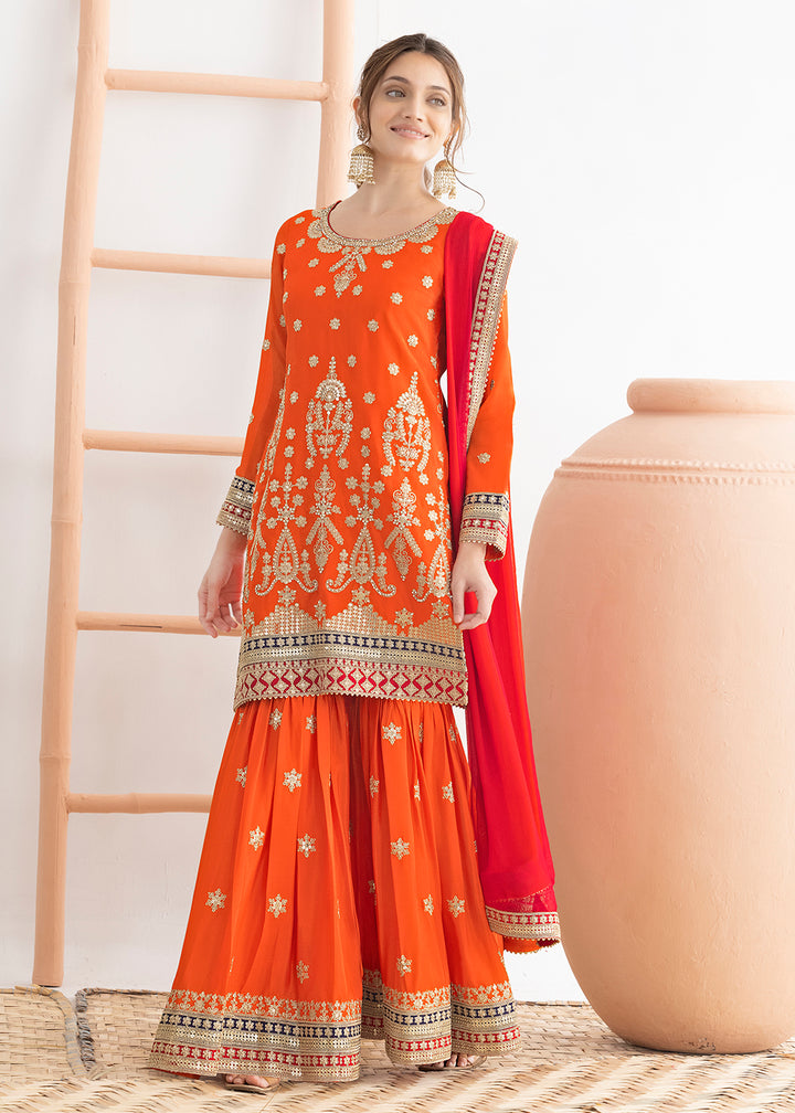 Buy Now Orange Beautiful Dabka Dori Gharara Style Suit Online in USA, UK, Canada, Germany, Italy, France, Austria, Denmark, Netherlands & Worldwide at Empress.