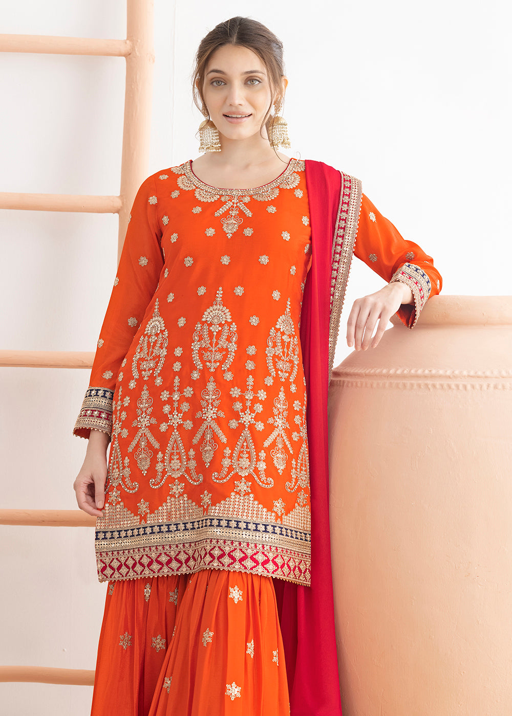 Buy Now Orange Beautiful Dabka Dori Gharara Style Suit Online in USA, UK, Canada, Germany, Italy, France, Austria, Denmark, Netherlands & Worldwide at Empress.