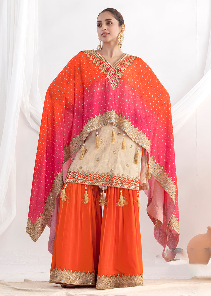 Shop Now Cream & Orange Embroidered Kaftan Style Gharara Dress Online at Empress in US, UK, Canada, Germany, Australia, Sweden, Denmark, UAE, Qatar & Worldwide.