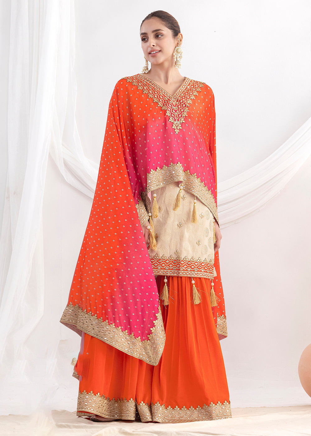 Shop Now Cream & Orange Embroidered Kaftan Style Gharara Dress Online at Empress in US, UK, Canada, Germany, Australia, Sweden, Denmark, UAE, Qatar & Worldwide.