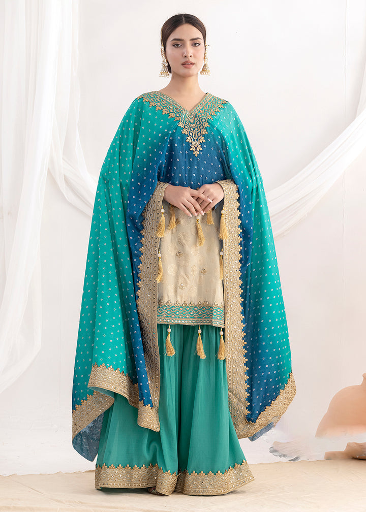 Shop Now Cream & Teal Embroidered Kaftan Style Gharara Dress Online at Empress in US, UK, Canada, Germany, Australia, Sweden, Denmark, UAE, Qatar & Worldwide.