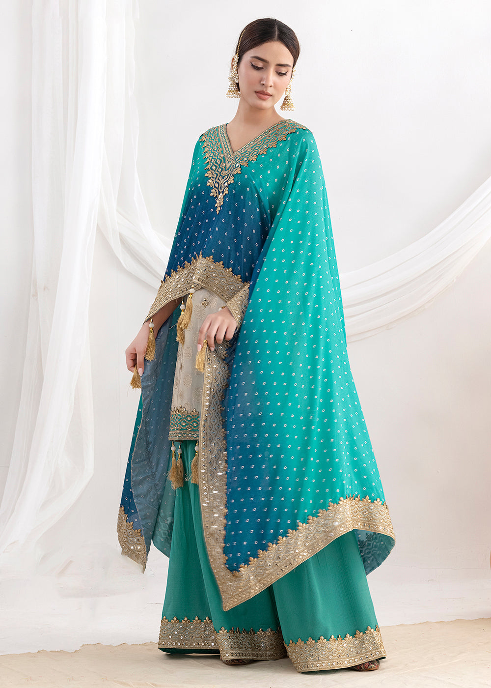 Shop Now Cream & Teal Embroidered Kaftan Style Gharara Dress Online at Empress in US, UK, Canada, Germany, Australia, Sweden, Denmark, UAE, Qatar & Worldwide.