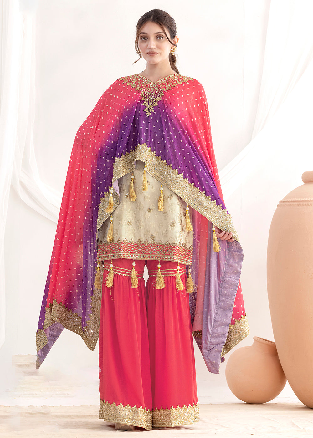 Shop Now Cream & Pink Embroidered Kaftan Style Gharara Dress Online at Empress in US, UK, Canada, Germany, Australia, Sweden, Denmark, UAE, Qatar & Worldwide.