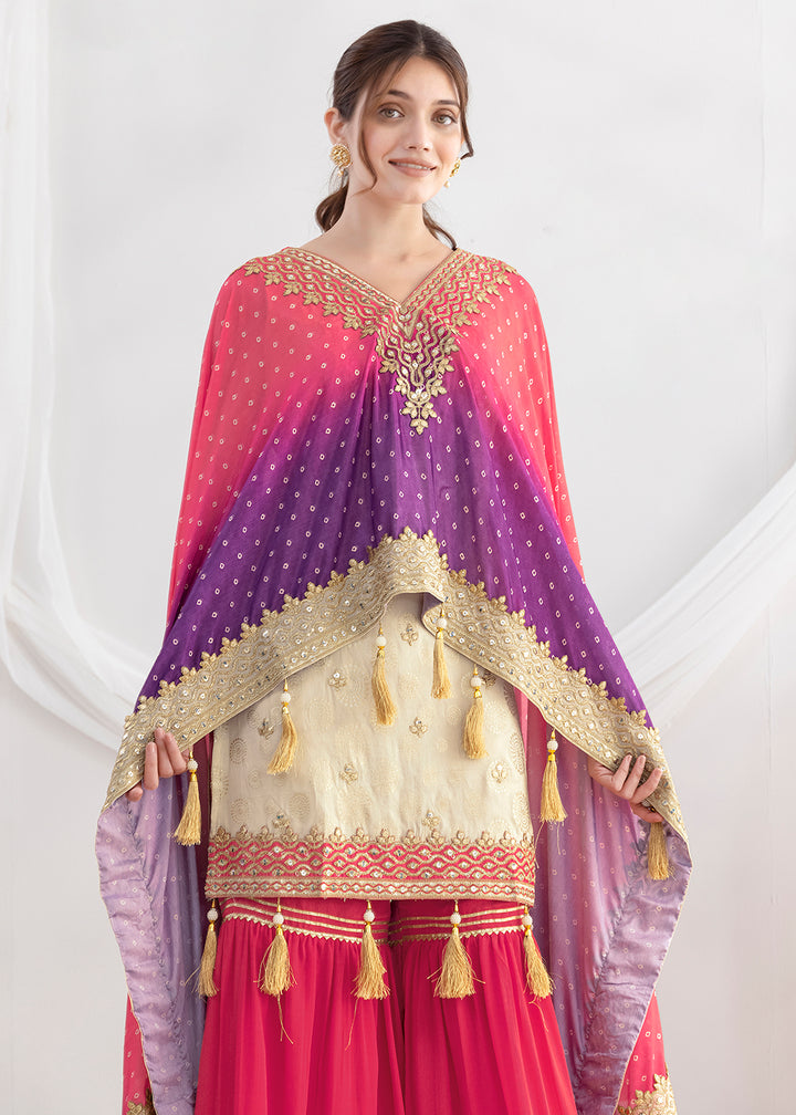 Shop Now Cream & Pink Embroidered Kaftan Style Gharara Dress Online at Empress in US, UK, Canada, Germany, Australia, Sweden, Denmark, UAE, Qatar & Worldwide.