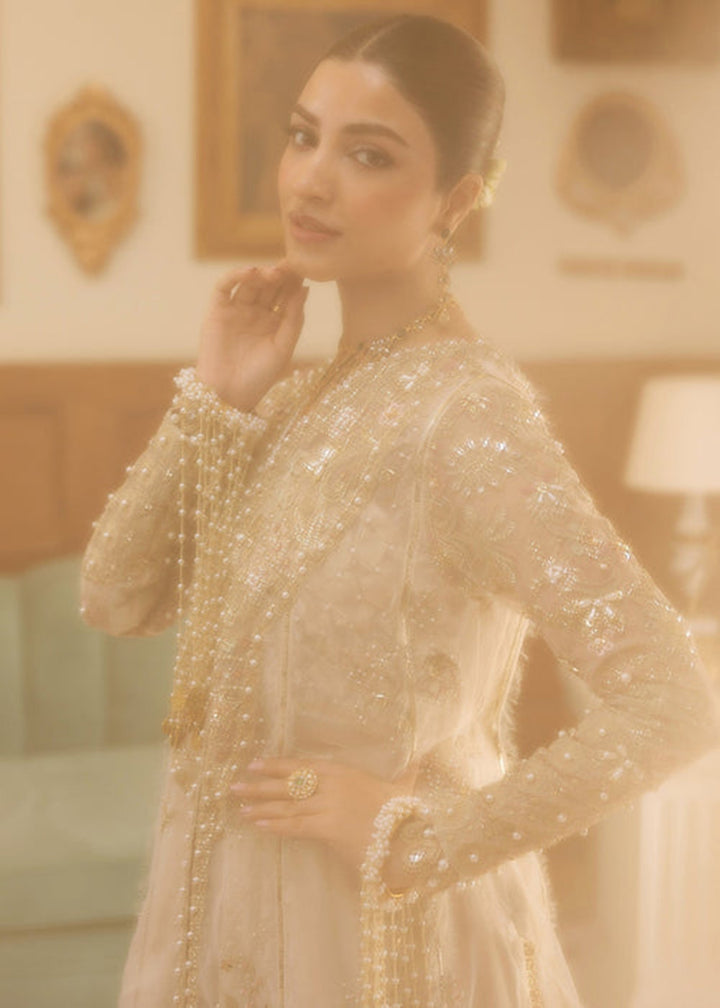 Buy Now Siraa Luxury Formals '25 by Sadaf Fawad Khan | Ivory Celeste Online in USA, UK, Canada, France, Italy, Germany, Sweden, UAE & Worldwide at Empress.