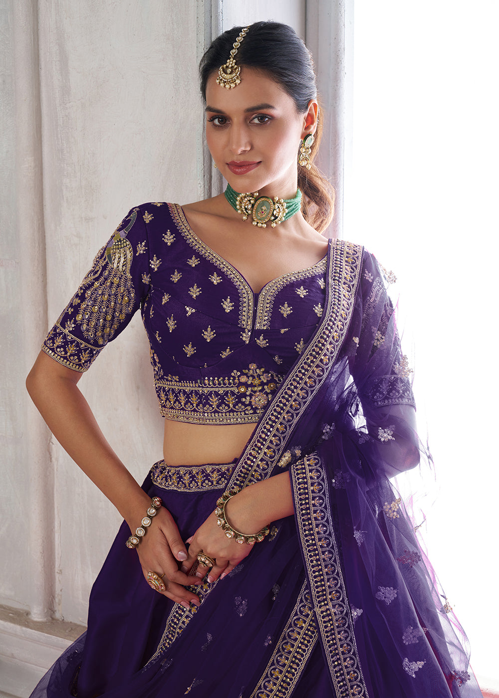 Buy Now Designer Purple Silk Lehenga Choli with Embroidered Peacock Motifs Online in US, UK, Canada, France, Italy, Greece, Sweden, UAE & Worldwide at Empress.