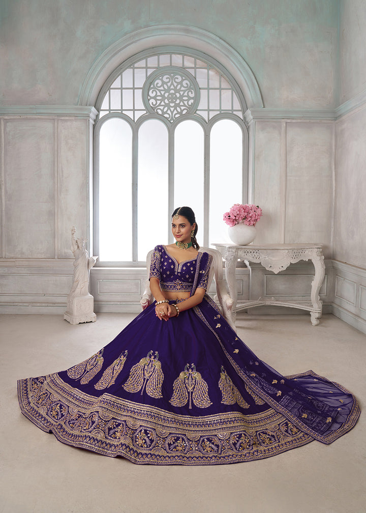 Buy Now Designer Purple Silk Lehenga Choli with Embroidered Peacock Motifs Online in US, UK, Canada, France, Italy, Greece, Sweden, UAE &amp; Worldwide at Empress.