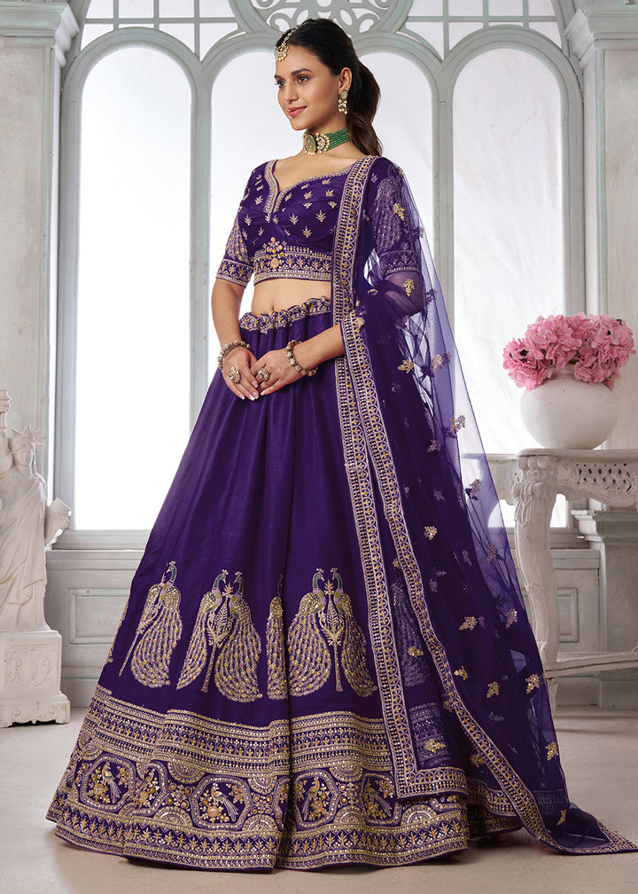 Buy Now Designer Purple Silk Lehenga Choli with Embroidered Peacock Motifs Online in US, UK, Canada, France, Italy, Greece, Sweden, UAE &amp; Worldwide at Empress.