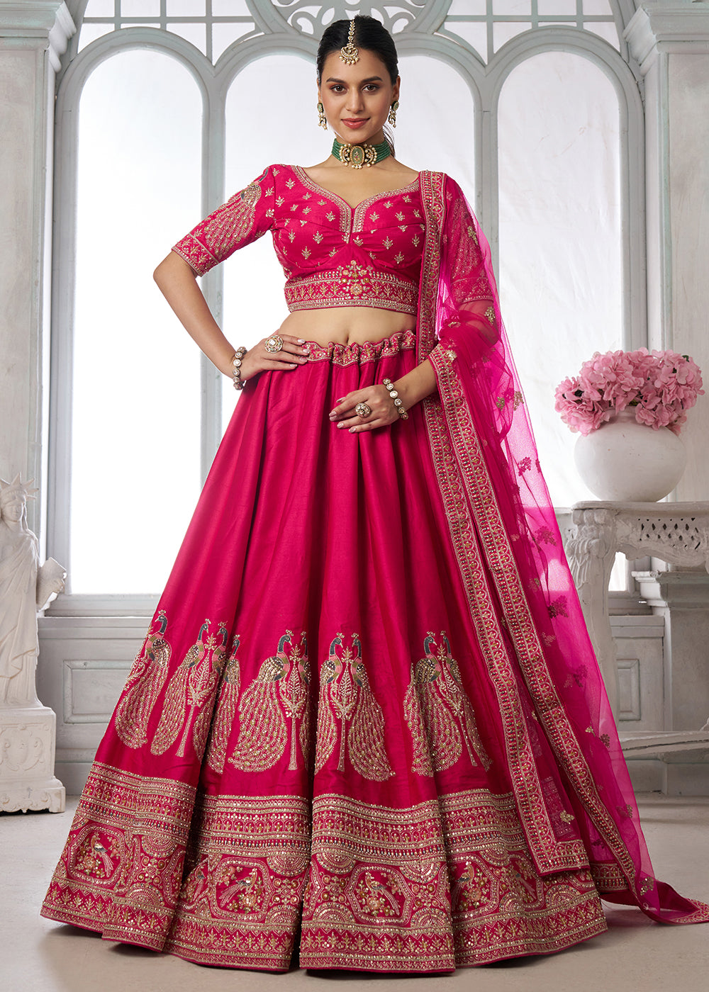 Buy Now Designer Pink Silk Lehenga Choli with Embroidered Peacock Motifs Online in US, UK, Canada, France, Italy, Greece, Sweden, UAE & Worldwide at Empress.